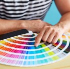 43778616 - graphic designer choosing a color from the sampler